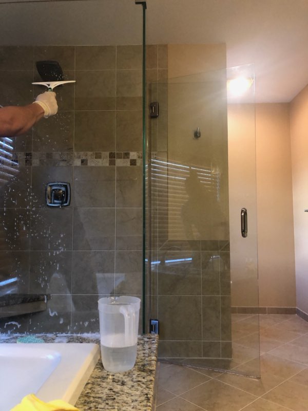 Cleaning a glass shower door